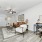 Sustainable apartment home living room with a couch coffee table and tv rendering of NOVO Avian Pointe