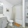 NOVO Avian Pointe apartment bathroom with bathtub toilet, large mirror and plentiful storage