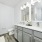Sustainable apartment bathroom with dual-vanity and large mirror at NOVO Avian Pointe