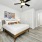 Rendering of NOVO Avian Pointe's sustainable apartment bedroom with bed and wall art