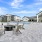 Lounge seating surrounding the firepit on the pool deck at NOVO Avian Pointe's Pool Deck