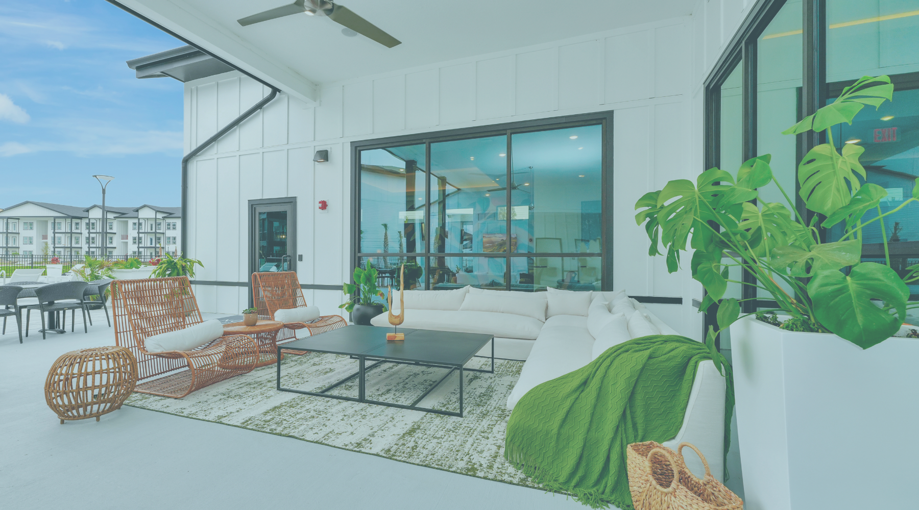 Love Where You Live Blue overlay on a photo of NOVO Avian Pointe's Pool Lounge